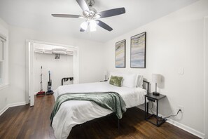 Super comfy bed, stylish furniture, and a fan to keep you cool all night long. 