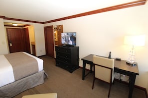 bedroom with television & desk