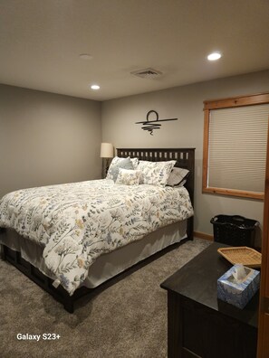 Bedroom 1 - includes queen size bed and 32-inch tv with streaming options.