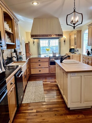 The gourmet chef's kitchen has a farm house sink imported from England.