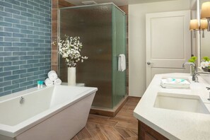 Primary Bathroom features a walk-in shower, soaking tub, and dual vanities.