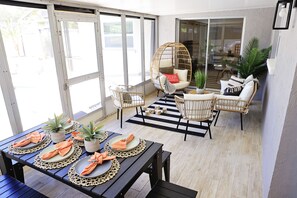 lanai with sitting area and dining