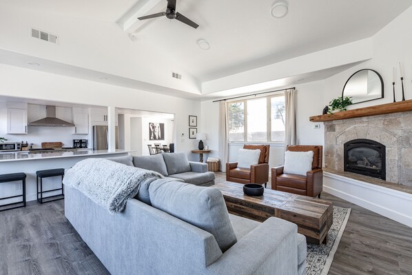 Living Room with Sofa Sleeper, fireplace, 75" Smart TV, kitchen
