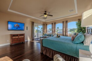 Haven of Comfort - - Bask in the sunlight pouring through panoramic windows in this elegant bedroom
- Soft bedding, smart TV and warm tones set the stage for ultimate relaxation
- A haven of comfort with direct balcony access for serene mornings