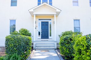 Beautiful main door with side lights.