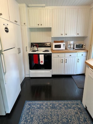 As you enter the cottage-- Fully stocked kitchen--
