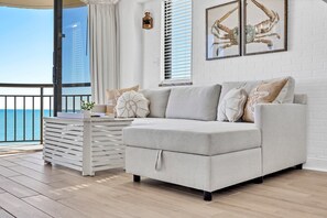 Pottery Barn pull out sleeper sofa with storage for the bedding under the chaise lounge part.  