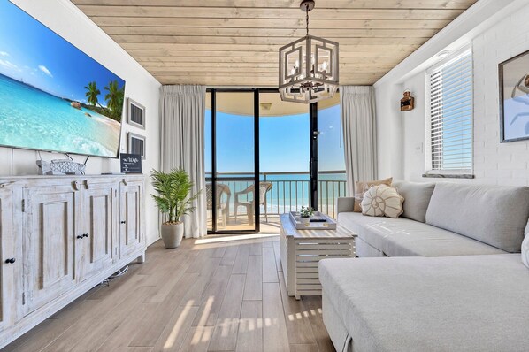 Stunning DIRECT Ocean Front tastefully remodeled great room.  End unit gives extra ocean views through the extra side window!  