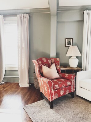 Settle into this cozy space, your perfect nook for relaxation or a good book.