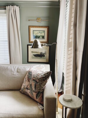 Charming corner space adorned with beautiful artwork, perfect for quiet moments.