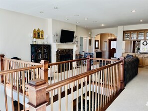 The living room has a 50 inch smart TV.  The room is is open to the floor below.