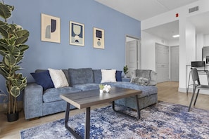 Unwind in the spacious living area complete with a comfy couch to relax after a long day exploring the city!