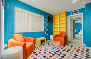 Vibrant living room with plush eclectic wing chairs 