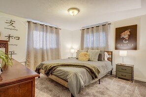 Basement bedroom has a comfortable queen sized bed