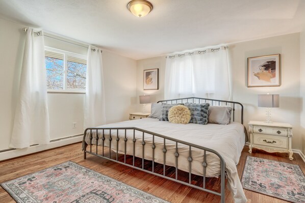 Upper level bedroom is bright and airy and offers a king sized bed!