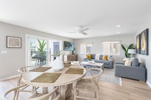 The dining table includes seating for 4. Sliding doors open out to the front patio for al fresco dining.
                