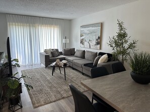 Sink into the cozy sofa, enjoy the glow of the sunset & relax with soft lighting