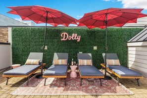 Perfect Rooftop Escape with Sun Loungers and Shaded Areas
