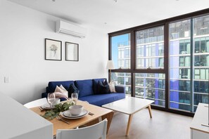 The living area with a 3-seater sofa bed that folds out to a double.