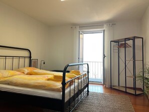 Bedroom with small balcony.