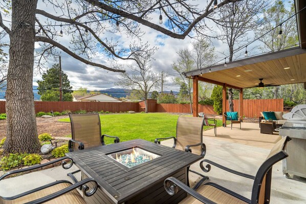 Relax by the fire pit and enjoy the private backyard