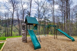 Private playset with 2 slides, monkey bars, fire pole
