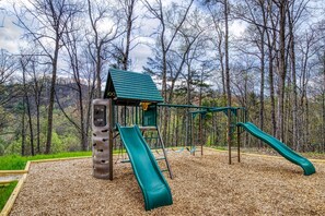 Playset with 2 slides, monkey bars, fire pole