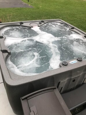 Escape to our serene retreat and soak away your cares in our inviting hot tub.