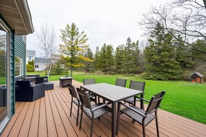 Our outdoor patio offers a grill and dining table, creating the perfect setting for meals with a view.