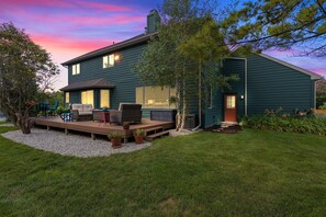 Patio paradise with a grill and cozy dining area, perfect for enjoying fresh air and delicious food.