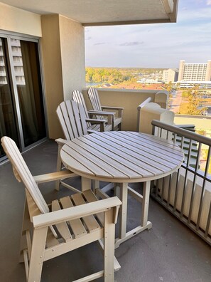 Four high top Adirondack chairs and 4 ft table for your meals with the view