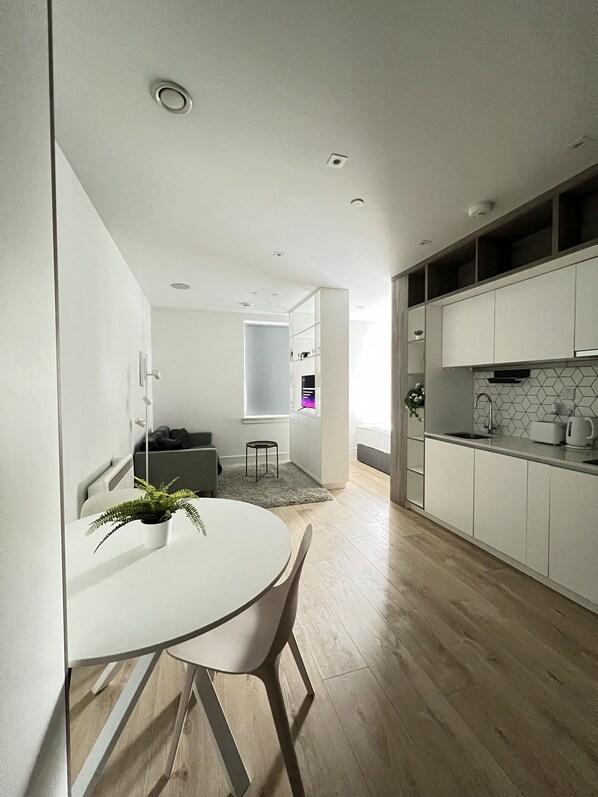 Modern living room connected to kitchen and dining area
