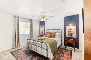 This queen bedroom blends modern with nautical charm.
