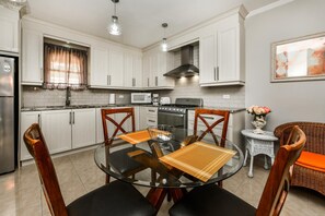 Gather 'round the table: From breakfast to dinner, create cherished memories with loved ones in this welcoming dining space.