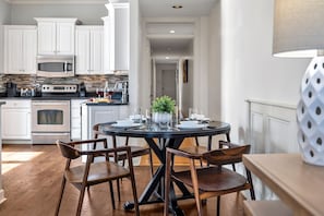 2nd Floor: Dining area offering a table to accommodate 4 guests during a meal or game night.