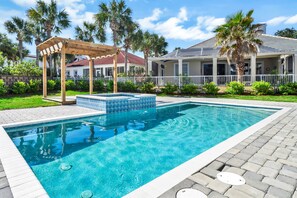 Boasting a Large Pool With Tropical Island Inspired Landscaping Makes It Hard to Want to Leave!