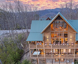 Nestled in nature, this rustic cabin offers a peaceful, secluded escape as dusk settles in. 🌅🏕️ Embrace the charm of the wilderness, unwind, and let nature’s beauty surround you."