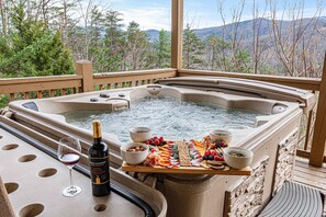Sip and soak in pure luxury! 🥂🌲 Surrounded by towering pines and breathtaking views, this 2nd hot tub offers the ultimate escape for relaxation and scenic bliss.