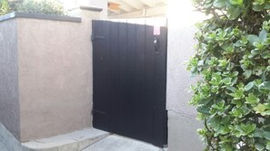 Black wood gate to enter backyard