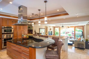 Cook like a pro in this gourmet kitchen with a sleek island, top-of-the-line appliances, and spacious layout, perfect for group meals.
