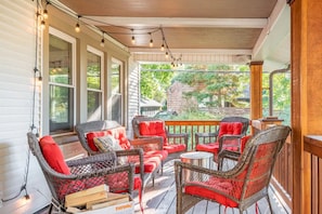 The covered porch comes equipped with a solo fire pit and stock of wood.