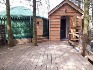 Kitchen and bathroom adjacent to yurt.