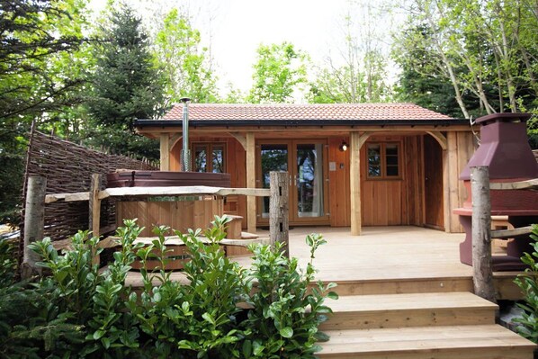 Decking with wood- fire hot tub for perfect relaxation.