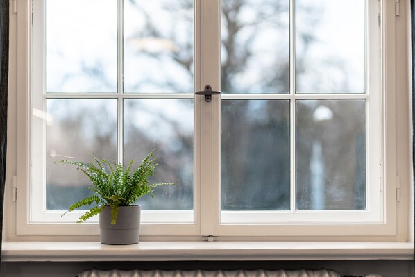 Surrounded by greenery outside, and a touch of greenery inside