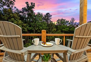 Start your day with coffee or wind down with a glass of wine while enjoying the peaceful treetop scenery.