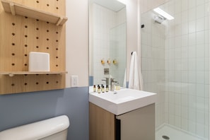 Bathroom features a walk-in shower.