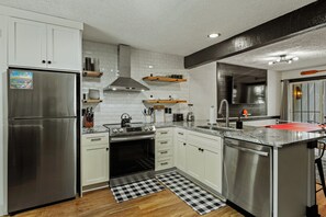 This kitchen is perfect for both preparing meals and gathering with loved ones.