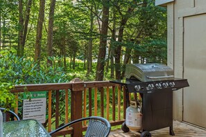 Weber grill on a deck.