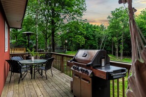 Deck with al fresco dining and BBQ grill.
