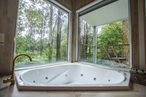 Lose yourself in the spa and overhead rain shower